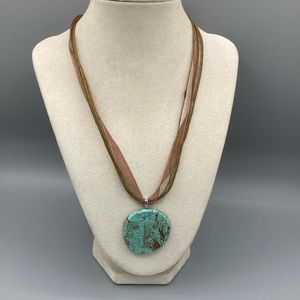 Polished Turquoise Pendant on Brown Ribbon